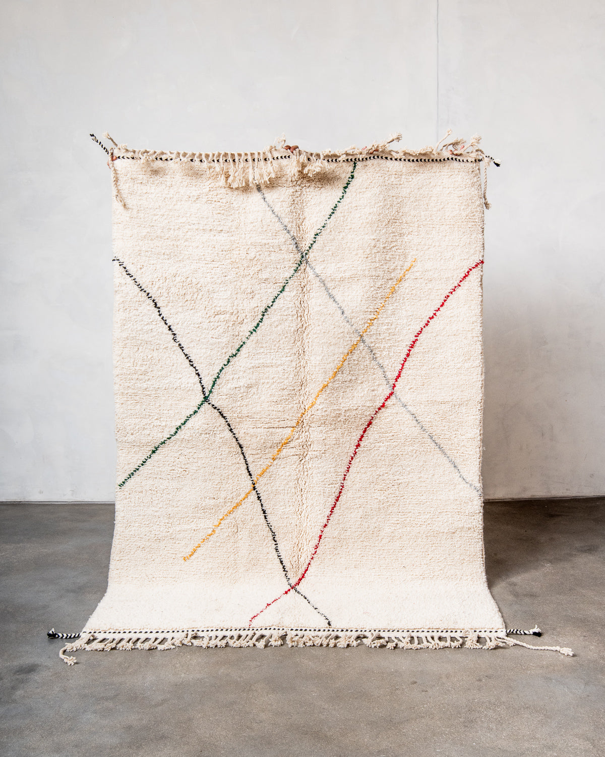 Modern, designer, handcrafted Berber rug from Morocco. Beniourain carpet with beautiful colours and patterns and fluffy wool texture.